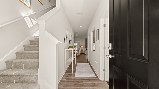 foyer and stairway with high ceiling
