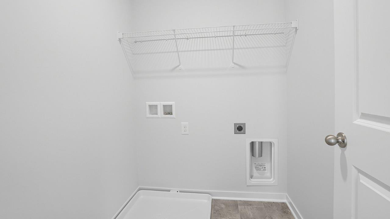 laundry room with wire shelving