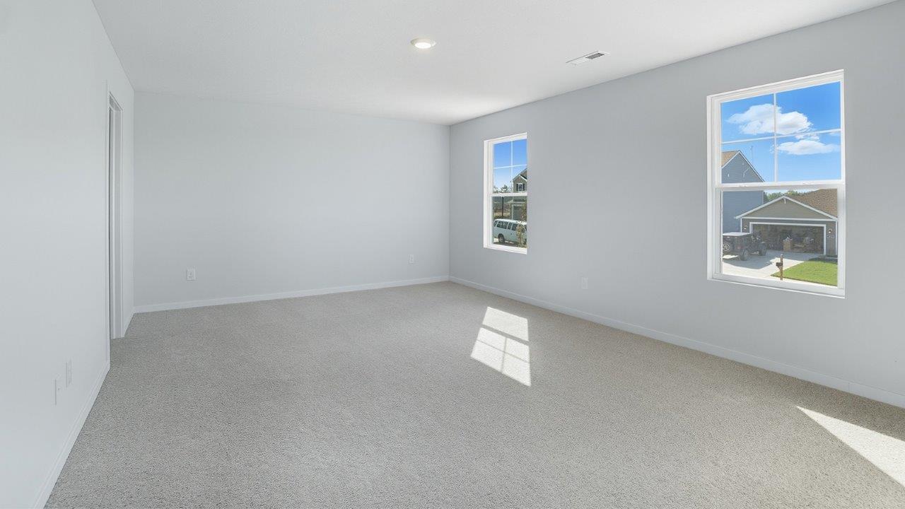 primary bedroom with single windows