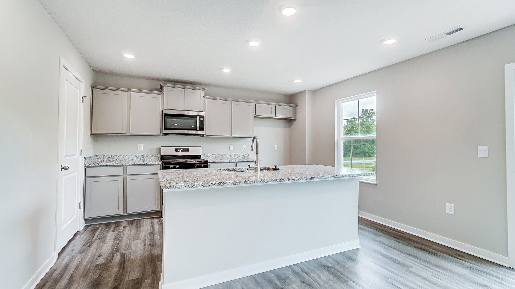grey cabinets, built in island, stainless steel appliances