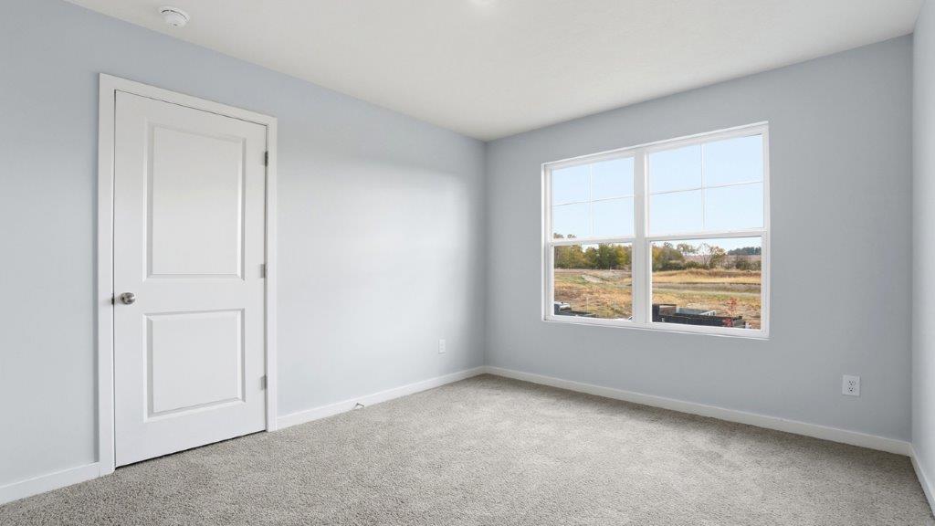 third bedroom with double window and closet