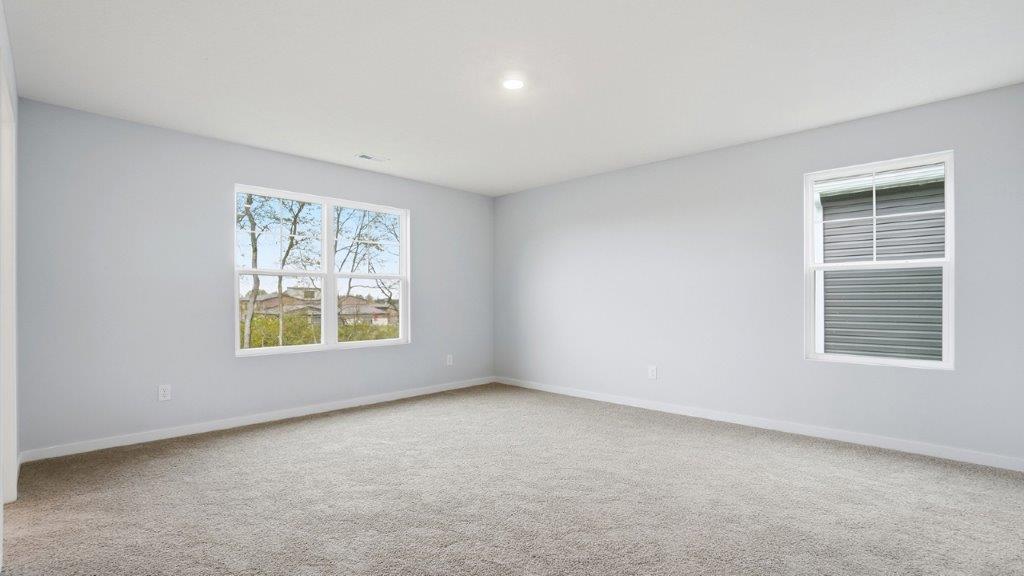 primary bedroom with two windows