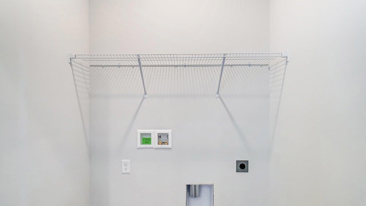 laundry room with wire shelving