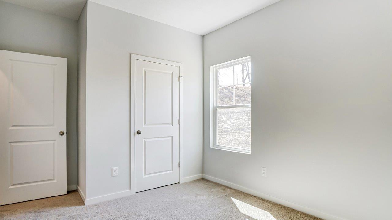 third bedroom entry, closet and single window