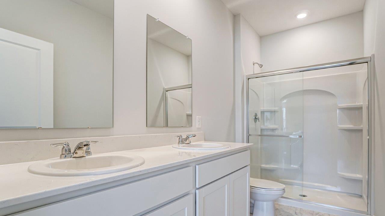 ensuite bath with double vanity, walk in shower