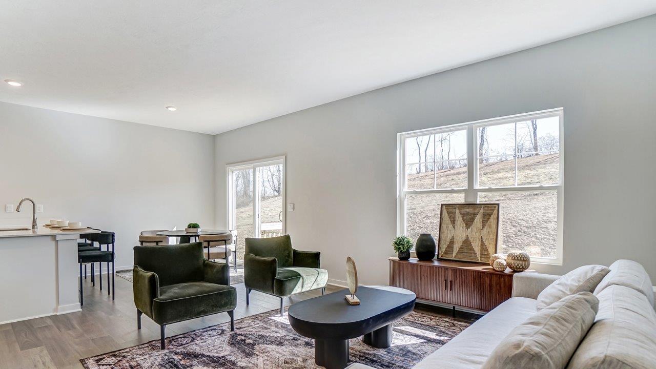 furnished great room with double window and rear sliding door