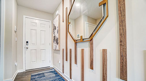 foyer with trim detail and mirror