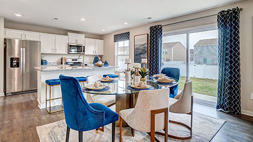 dining table with chairs, rear sliding door, kitchen