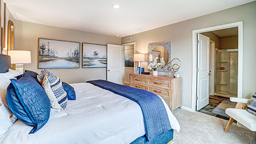 furnished primary bedroom and ensuite bath