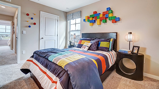 furnished second bedroom closet and entry