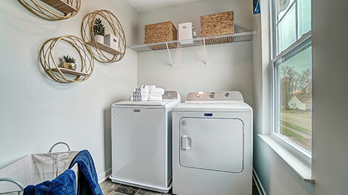 laundry room with washer, dryer and wire shelving