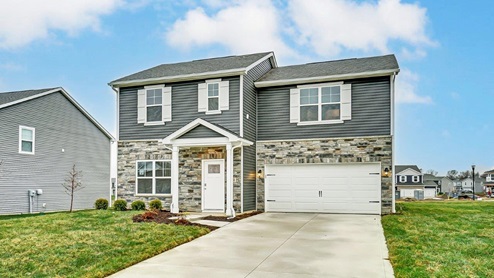 two story home with grey siding, partial stone front, covered entry, two car garage - Juniper floor plan