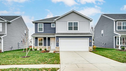 Two story home with grey siding, covered front porch and two car garage - Sienna floor plan