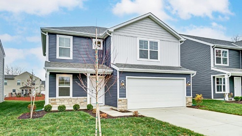 Two story home with grey siding, covered front porch and two car garage - Sienna floor plan angle