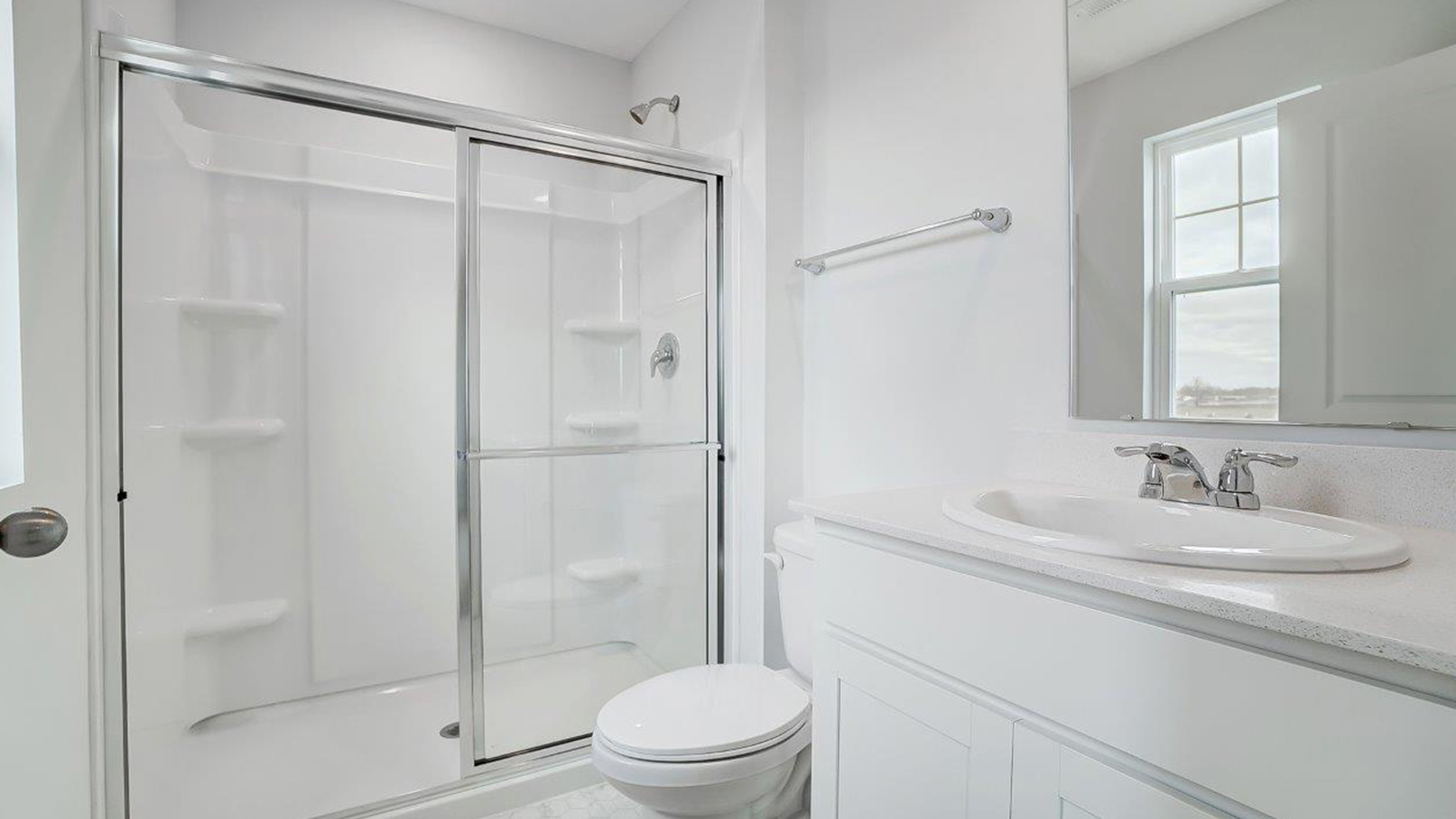 ensuite bath with single vanity and walk in shower