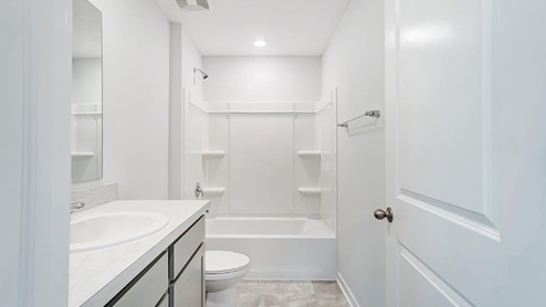 Interior bathroom with sink and full-sized shower