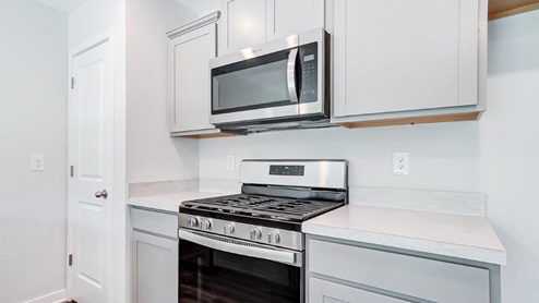 Interior kitchen with light grey cabinets