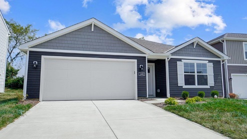 Exterior dark grey home with light blue cladding
