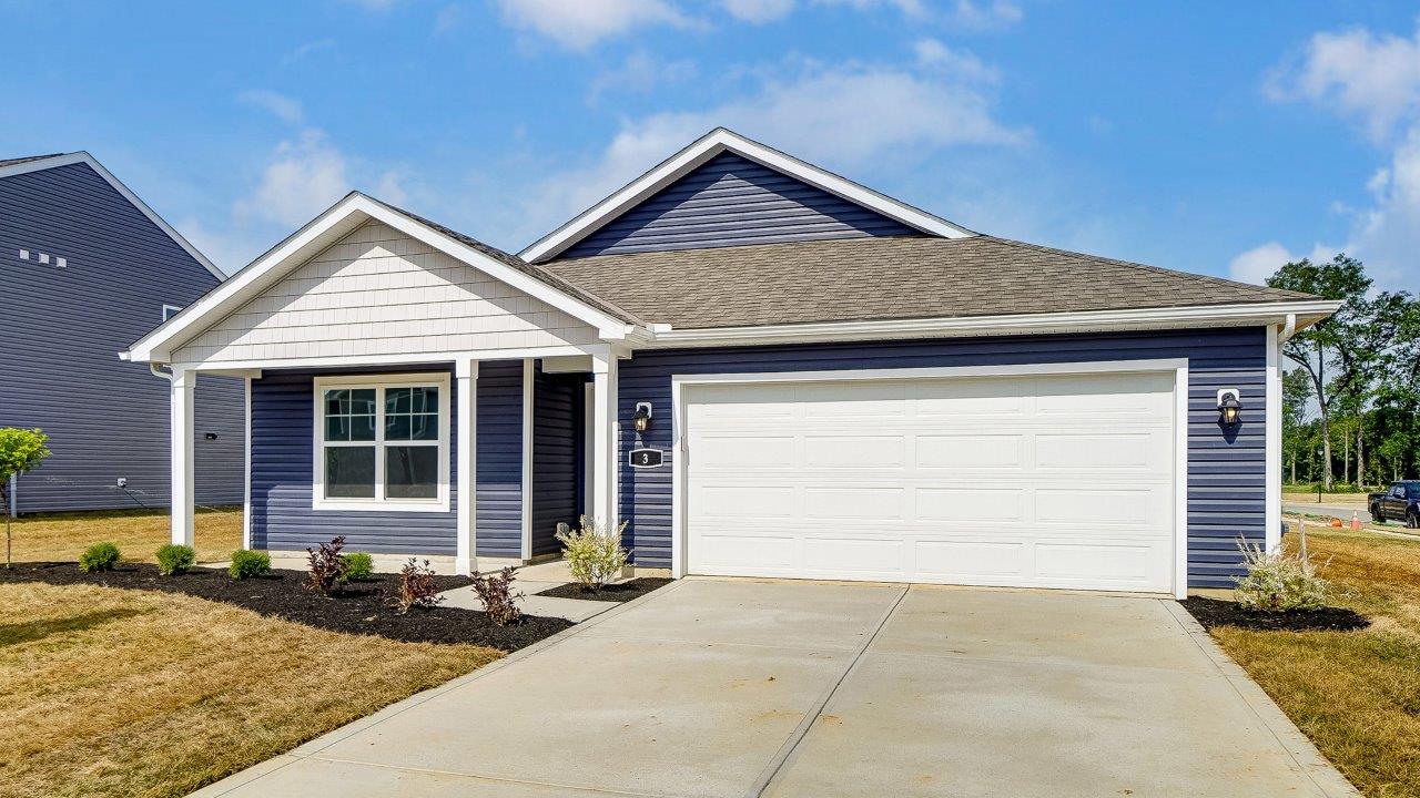 single story home with blue siding, covered front porch, two car garage