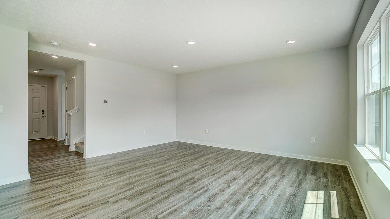 white cabinets, stainless steel appliances, hard surface counters, single window