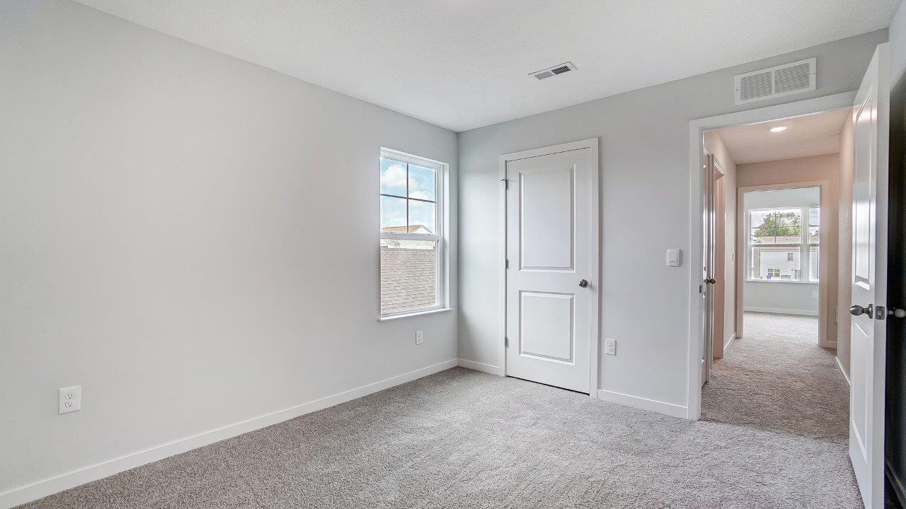 fourth bedroom with single window, closet and entry