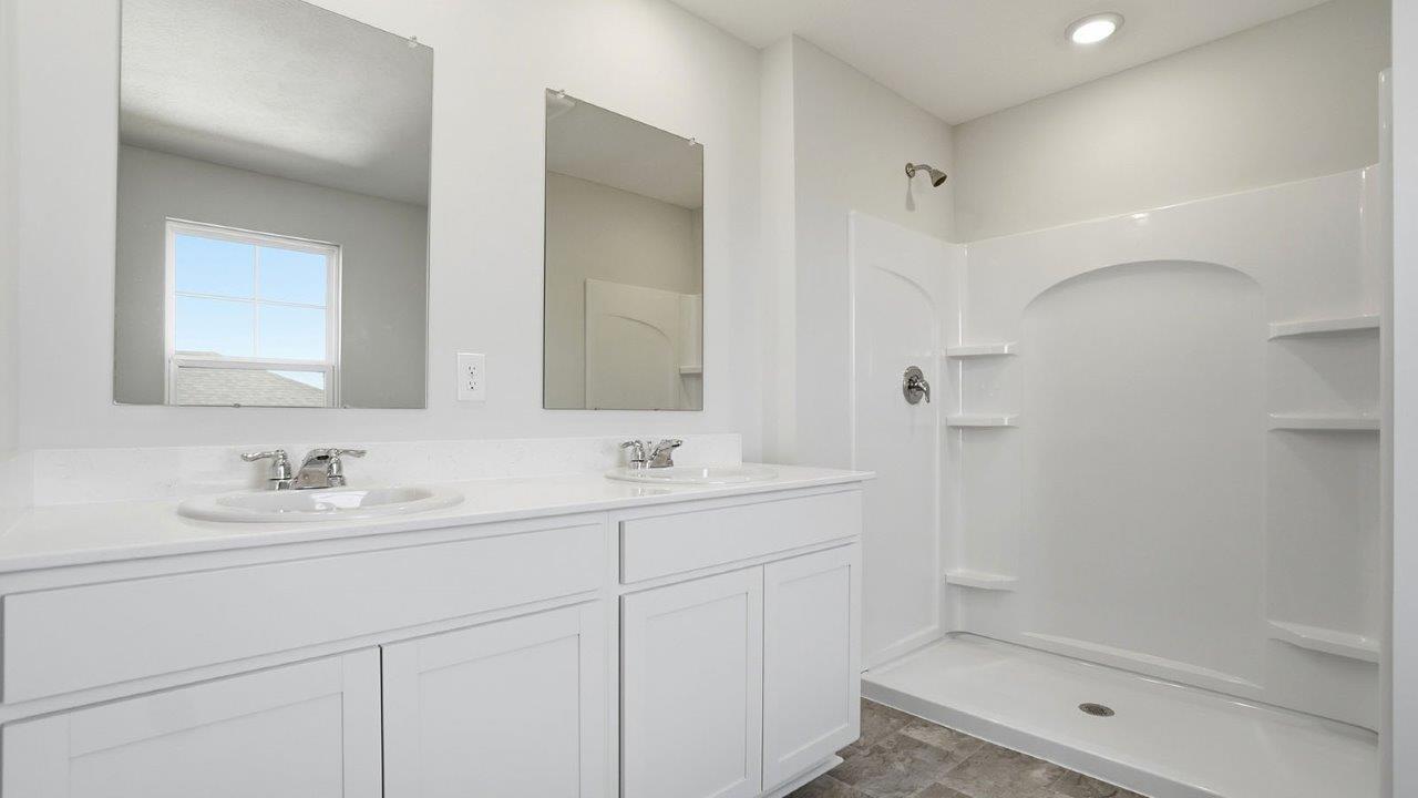 ensuite bath with double vanity and shower