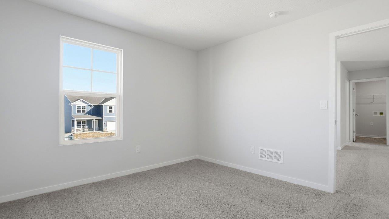 third bedroom with single window and entry