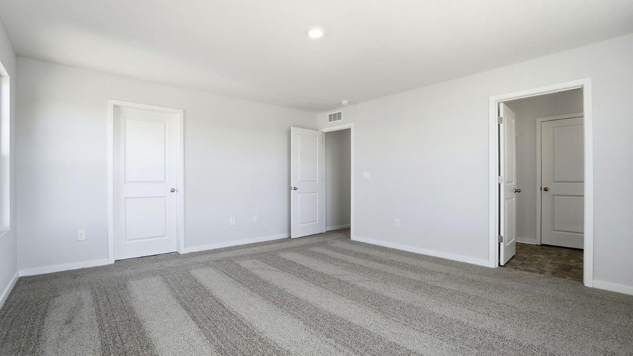 primary bedroom closet, entry and ensuite bath