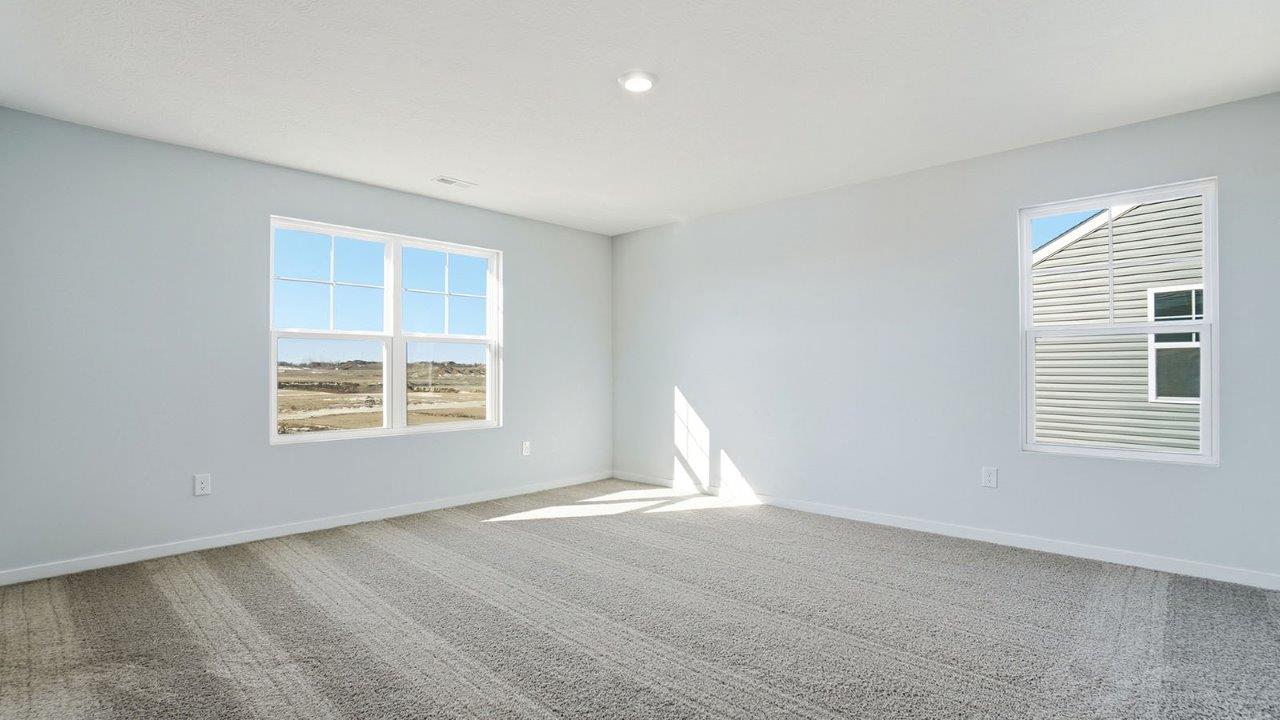 primary bedroom with double and single window