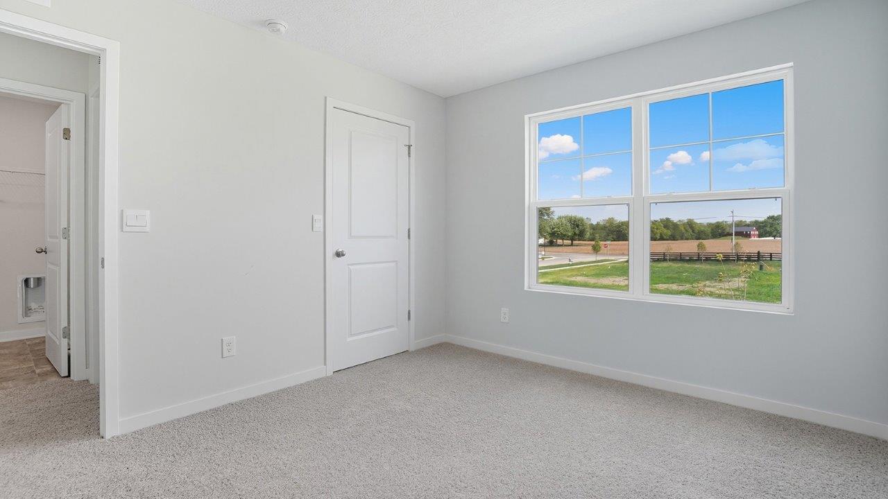 second bedroom with double window and entry