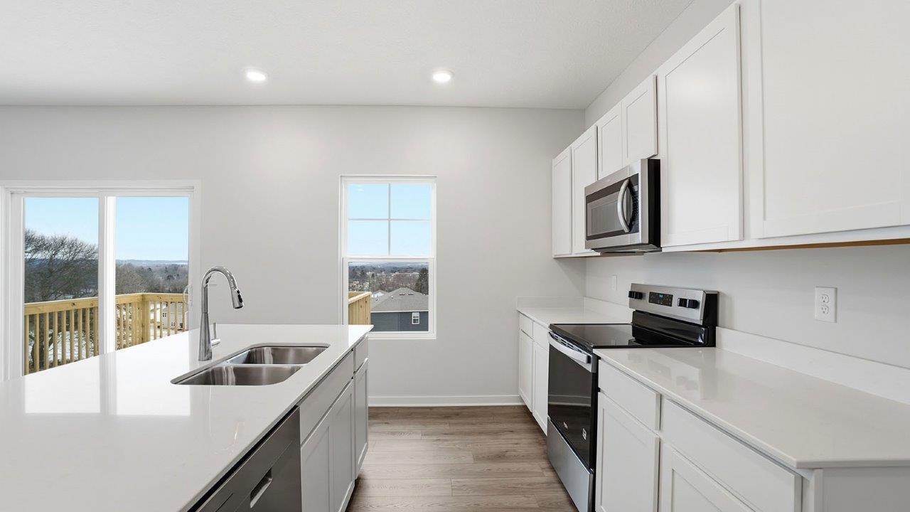 Bellamy kitchenw ith white cabinets