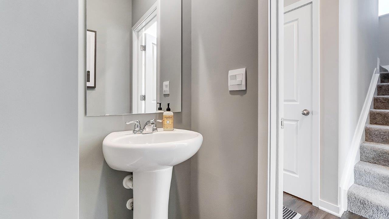 first floor powder room with pedestal sink