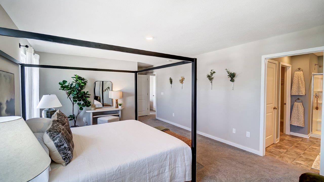 furnished primary bedroom with ensuite bath