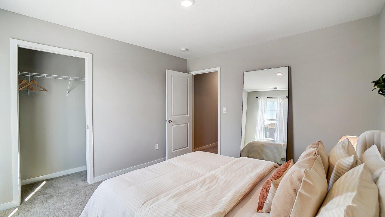 furnished third bedroom closet and entry