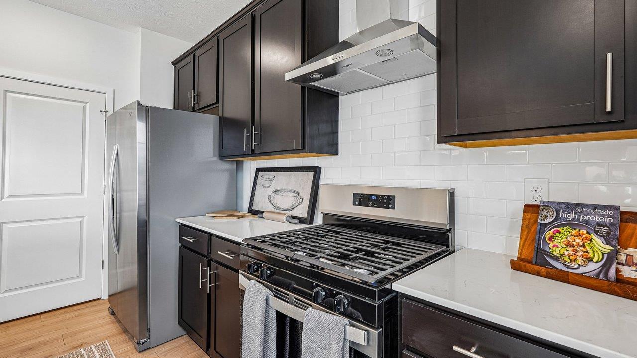 Bellamy kitchen with brown stain cabinets