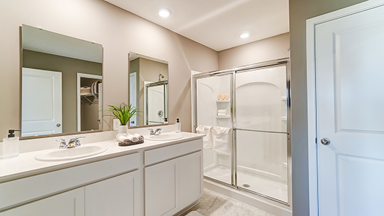 ensuite bath with double vanity, walk in shower, water closet