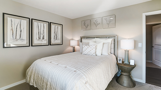 furnished second bedroom and entry