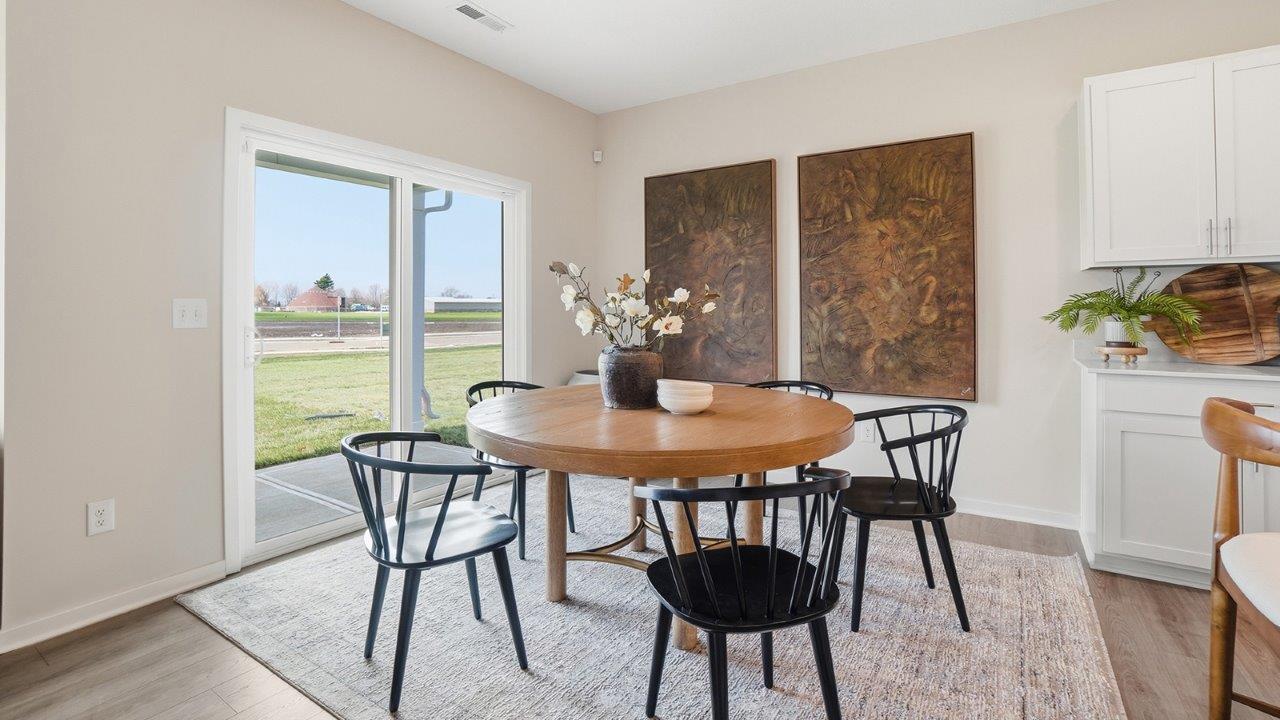 dining room with table, chairs and rear sliding door
