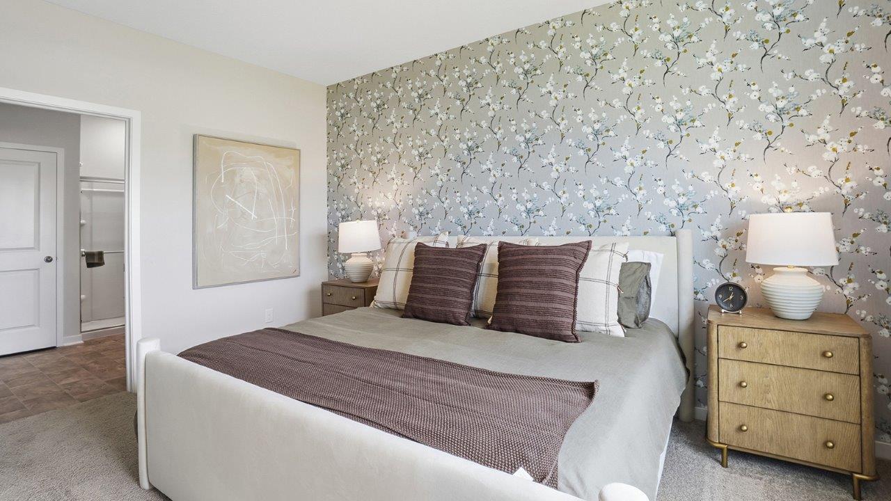 furnished primary bedroom and ensuite bath