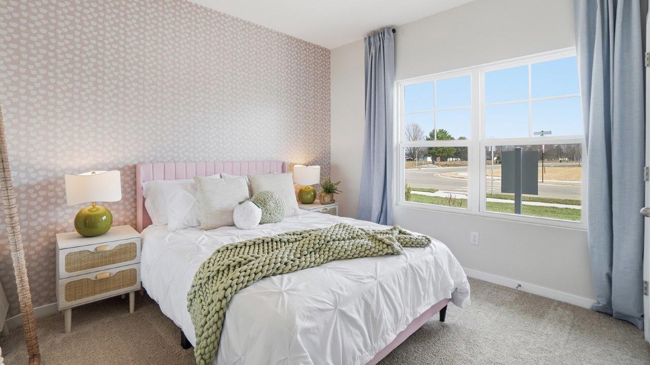 furnished secondary bedroom with double window