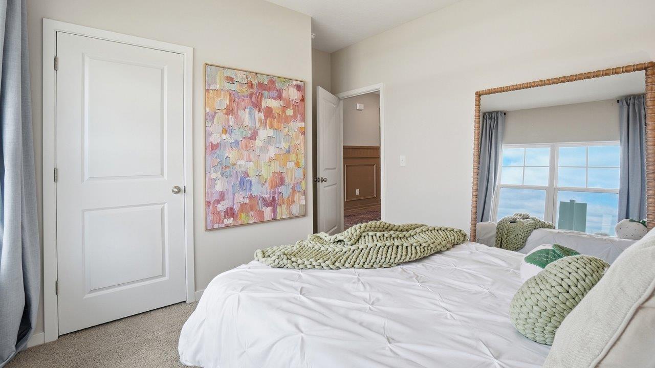 furnished secondary bedroom closet and entry