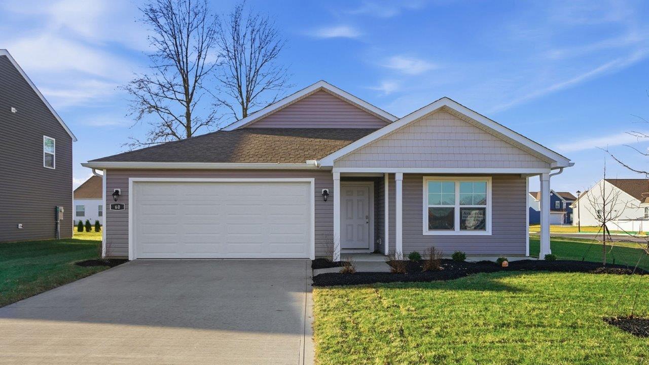 single story home with grey siding, covered front porch and two car garage