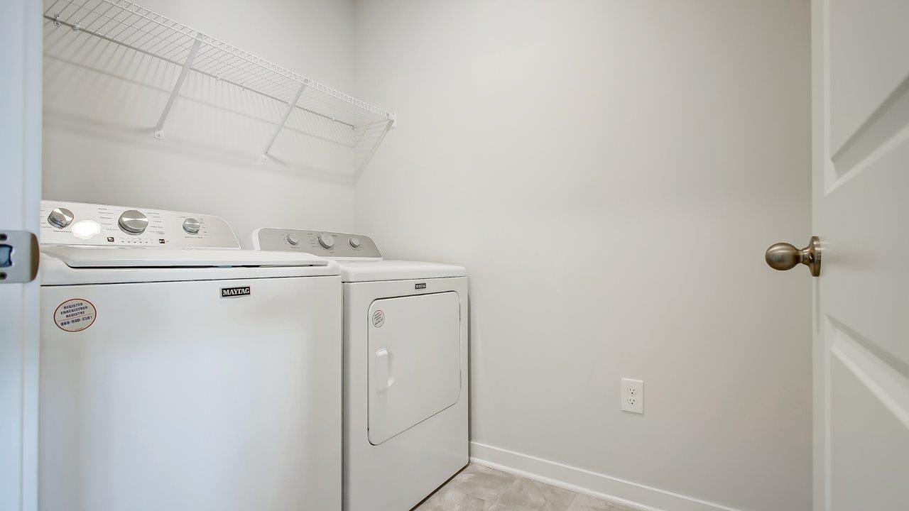 laundry room with washer, dryer and wire shelving