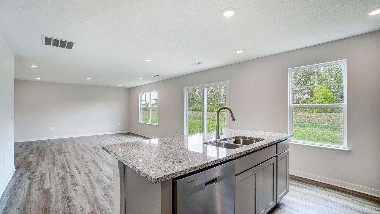 built in island, great room, single window and rear sliding door