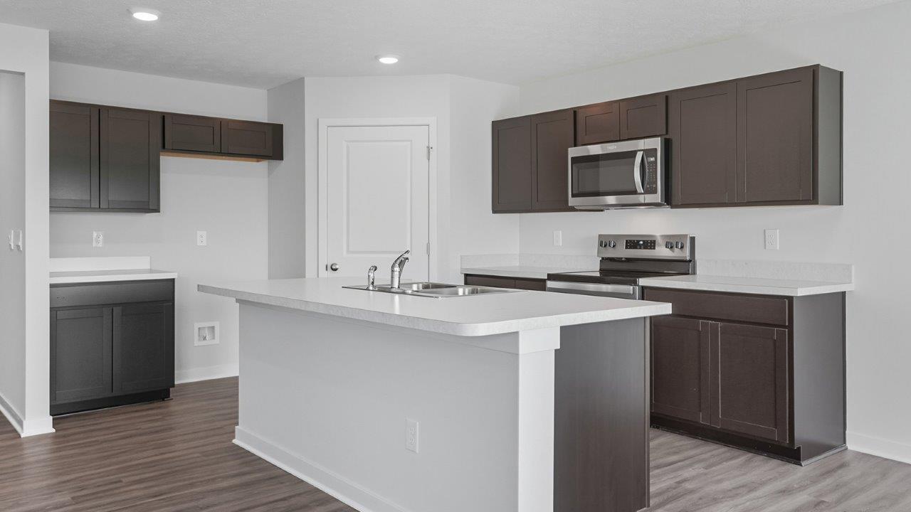 Henley kitchen with dark stain cabinets