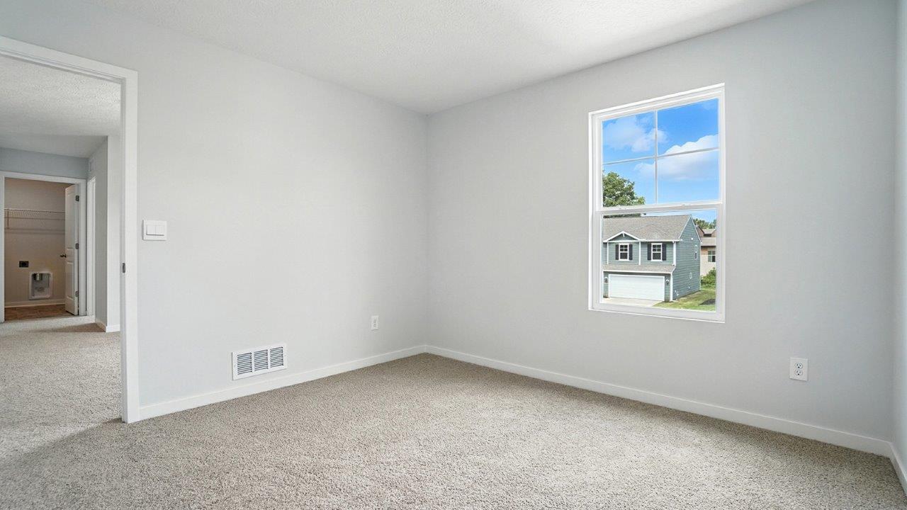 fourth bedroom with single window and entry