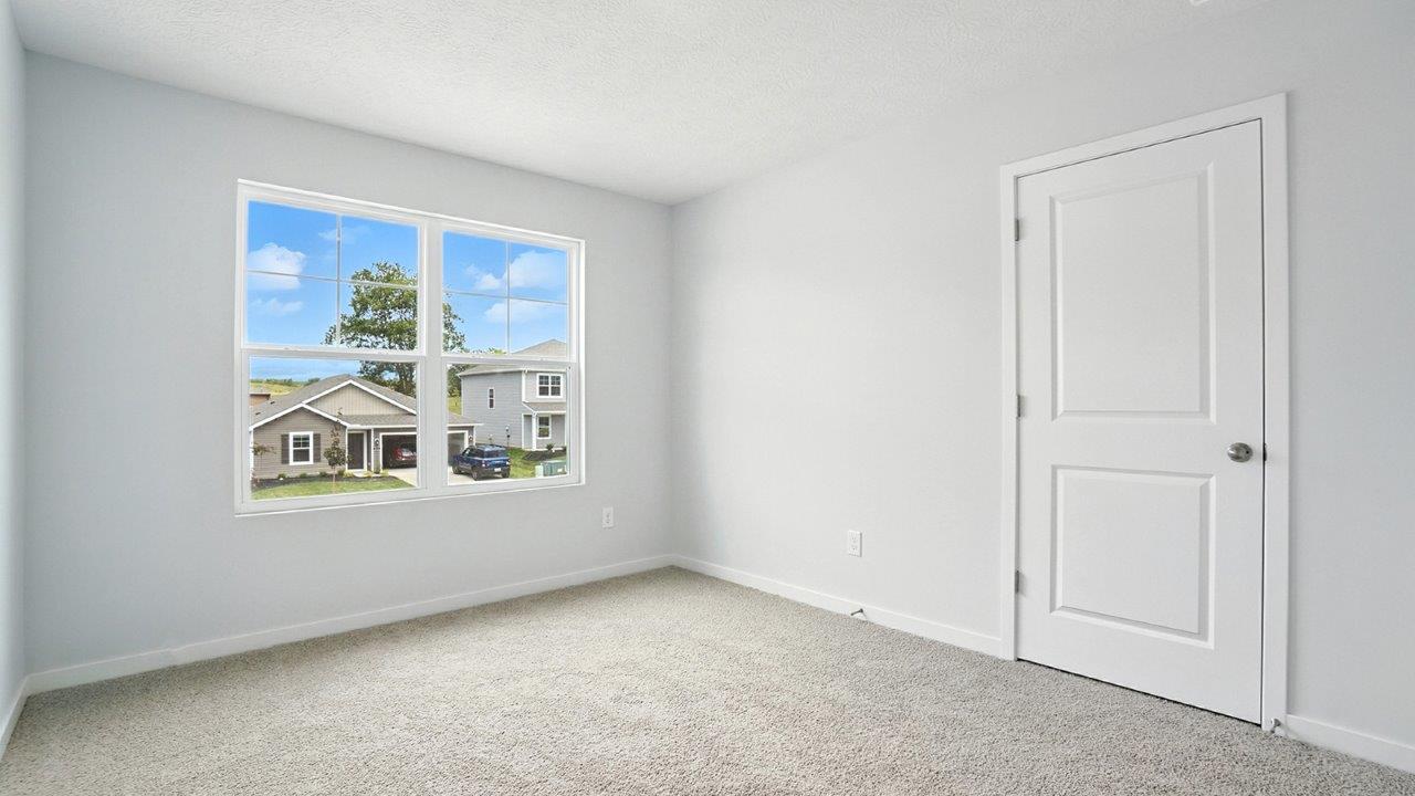 third bedroom with double window and closet