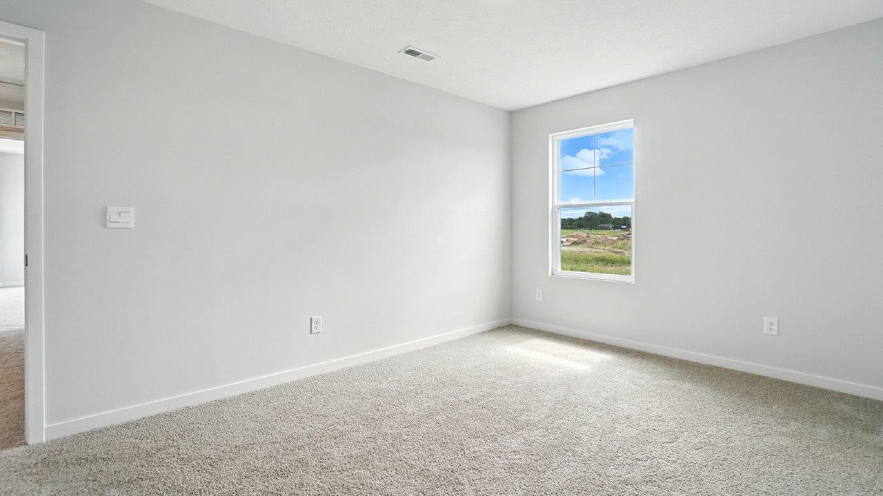 second bedroom with single window and entry