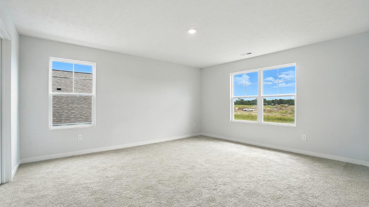 primary bedroom with two windows