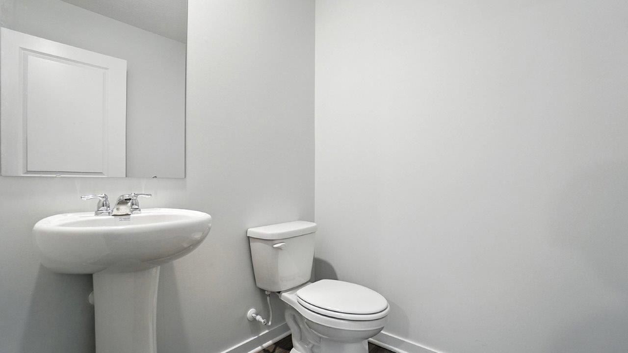 first floor powder room with pedestal sink